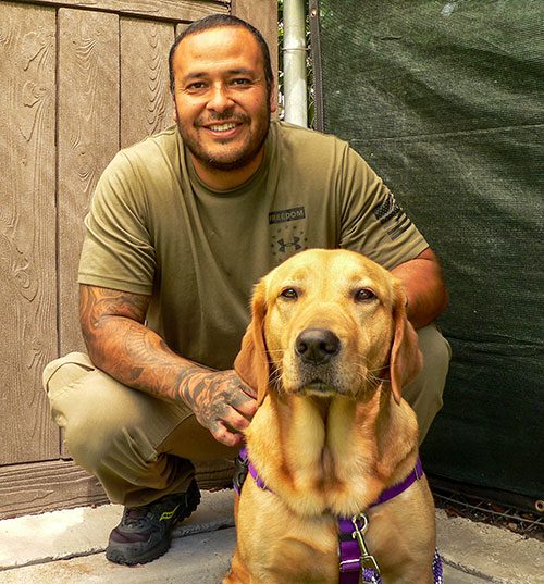 Carlos and his service dog, Liberty