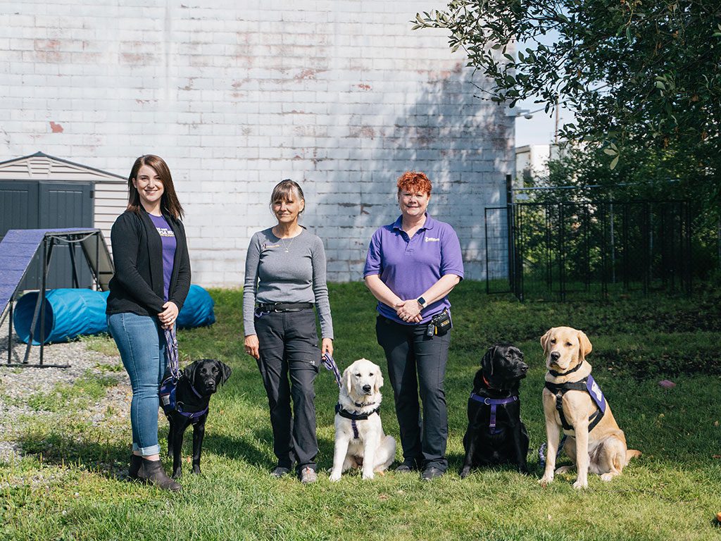 Our Alaska team with Service Dogs-in-training Shapiro, Tanklage, and Kreitzberg
