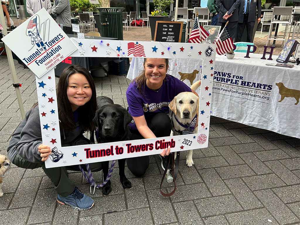Service Dog-In-Training, Jeanette; Ambassador Dog, Delta; Program Instructor, Mami; and National Program Manager, Casey, Get Hyped Before the Climb!